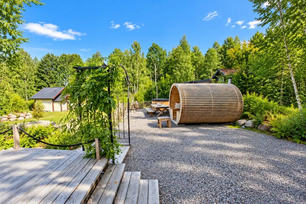 Panoramic barrel sauna in the forest wellness area