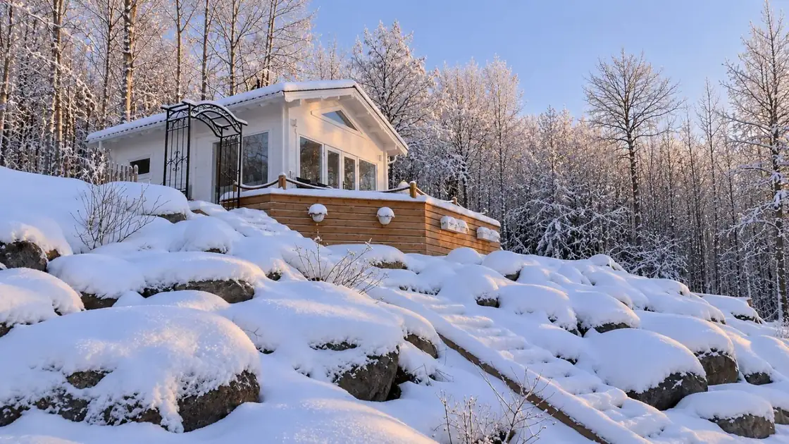 Lakeview Loft surrounded by snow at Tree of Life Sweden